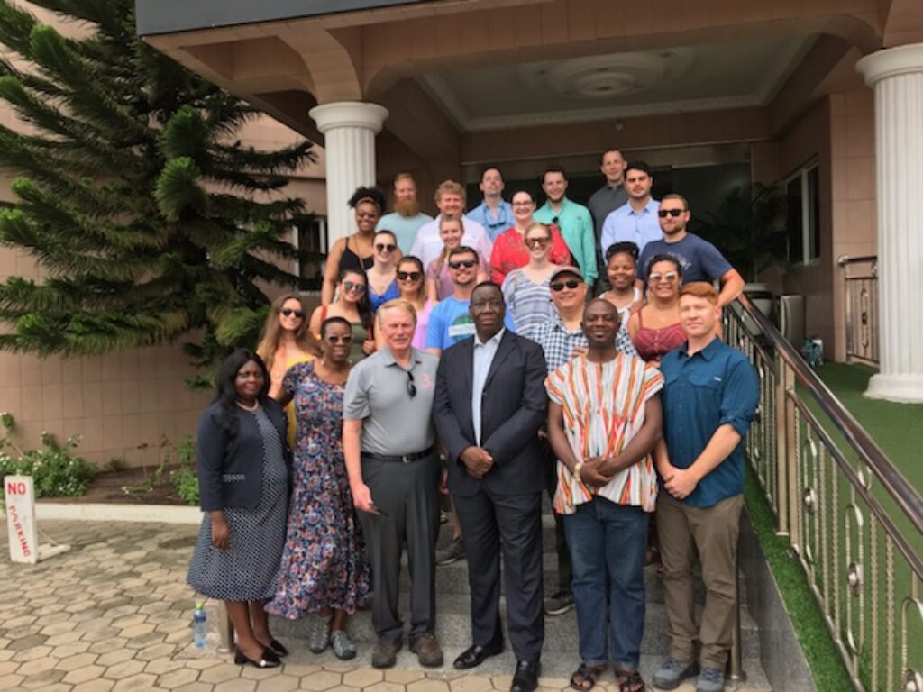 Group of Campbell Law students, professors and administration pose for photo on first day in Ghana