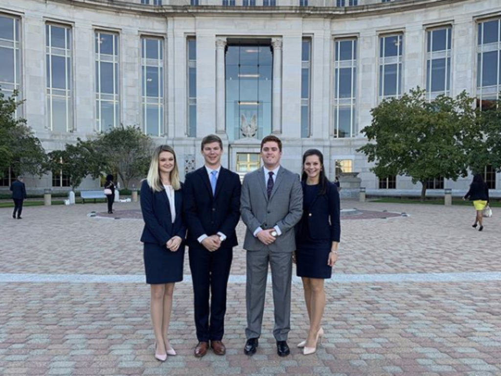 Photo of four Campbell Law advocates standing in front of Montgomery, Alabama court house