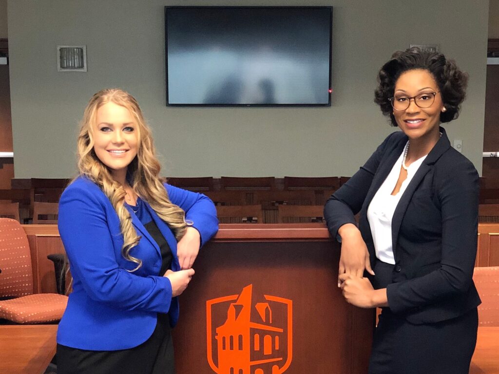 Photo of two Duberstein advocates posing in courtroom