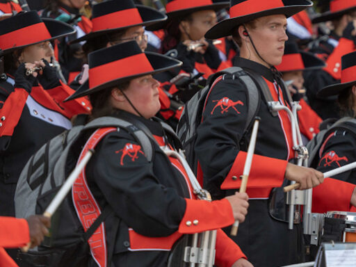 Senior Drumline Members Olivia Exum And Camden Little with sticks playing in the Marching Band