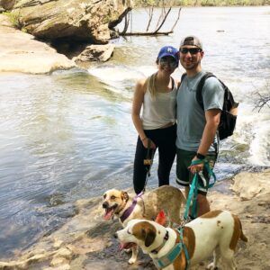 Allí Howell with dogs at the river