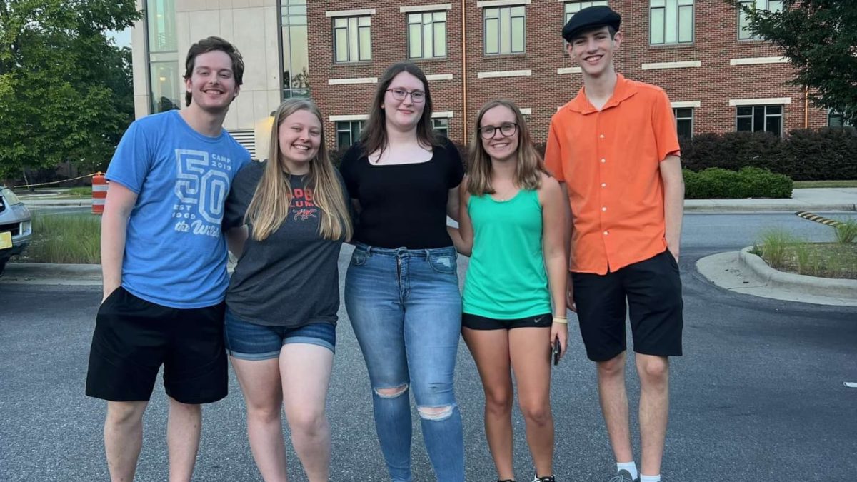 Emma Guild (center) with fellow students