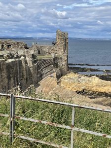 Photo of a Scottish castle with the sea in the background