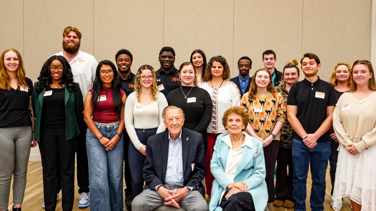 Barker Scholars posing with Bob and Pat Barker