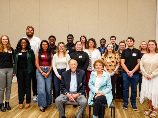 Barker Scholars posing with Bob and Pat Barker