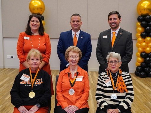 Three Golden Club inductees seated in a row with Alumni Board president Rebecca Brock, Campbell president Dr. William M. Downs and Director of Planned Giving Grant Harden standing behind