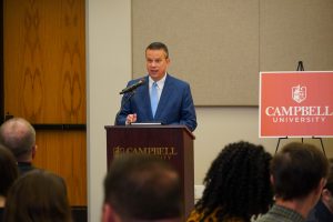 President William M. Downs speaking at podium