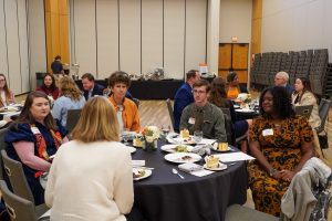 Golden LEAF scholars speaking with staff at tables