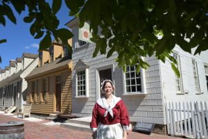 Student standing outside the apothocary.