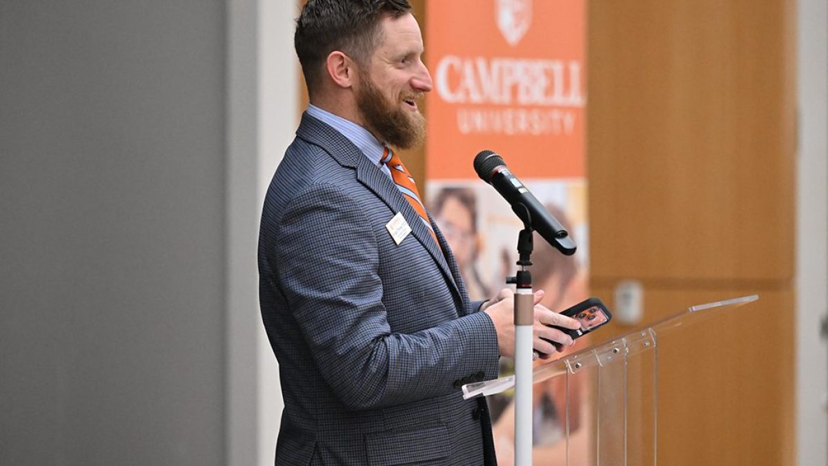 Morgan Timiney giving a speech at a podium during a Campbell University event