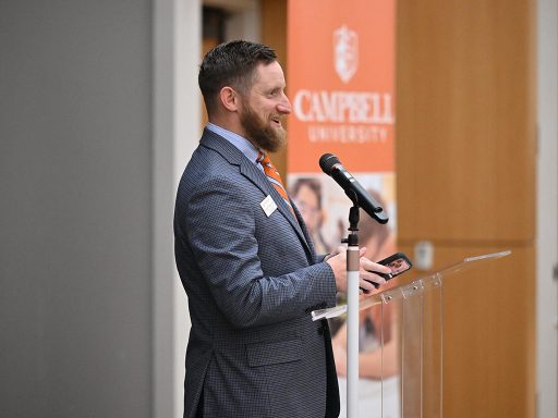 Morgan Timiney giving a speech at a podium during a Campbell University event