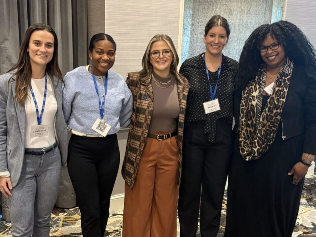 Photo of five women posing with Charlotte Munsey '28 on the left
