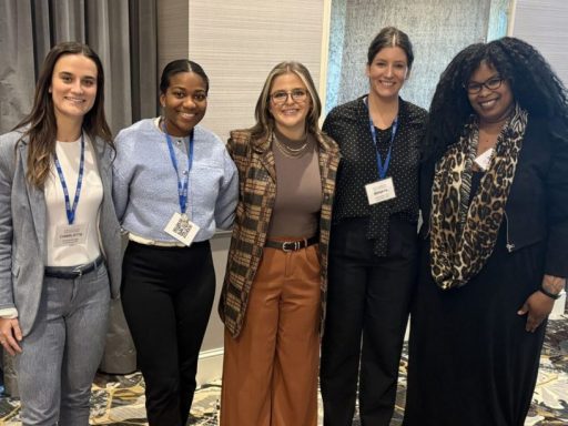 Photo of five women posing with Charlotte Munsey '28 on the left