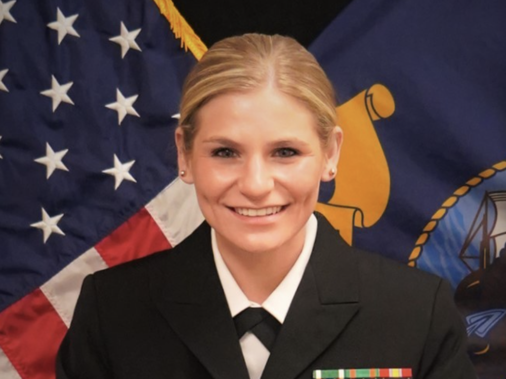 Photo of Lt. Summer Combs '21 in her U.S. Navy JAG uniform
