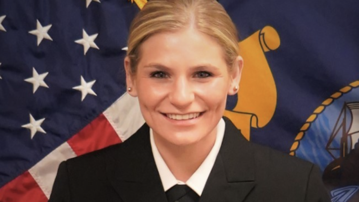 Photo of Lt. Summer Combs '21 in her U.S. Navy JAG uniform